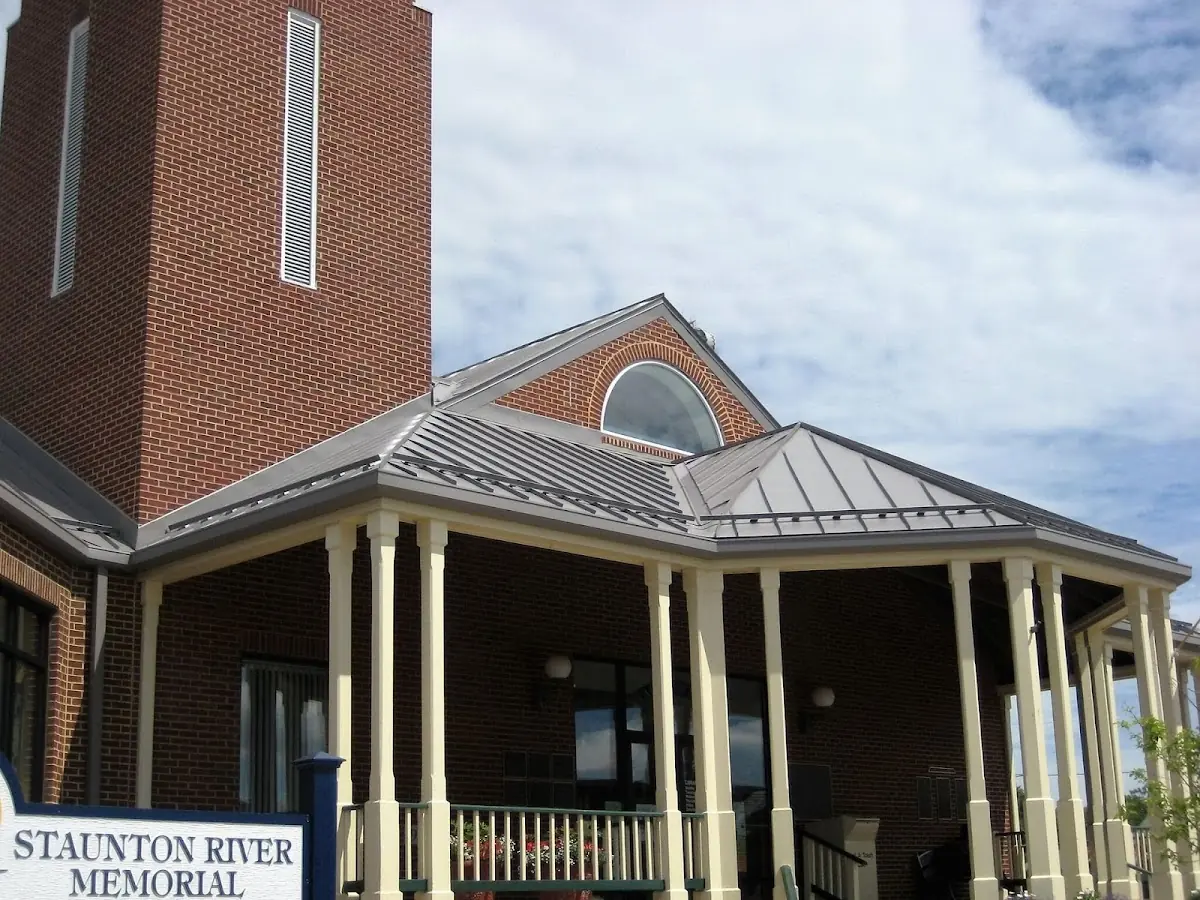 Skilled roofing craftsmen working on a residential roof in Gurleyville